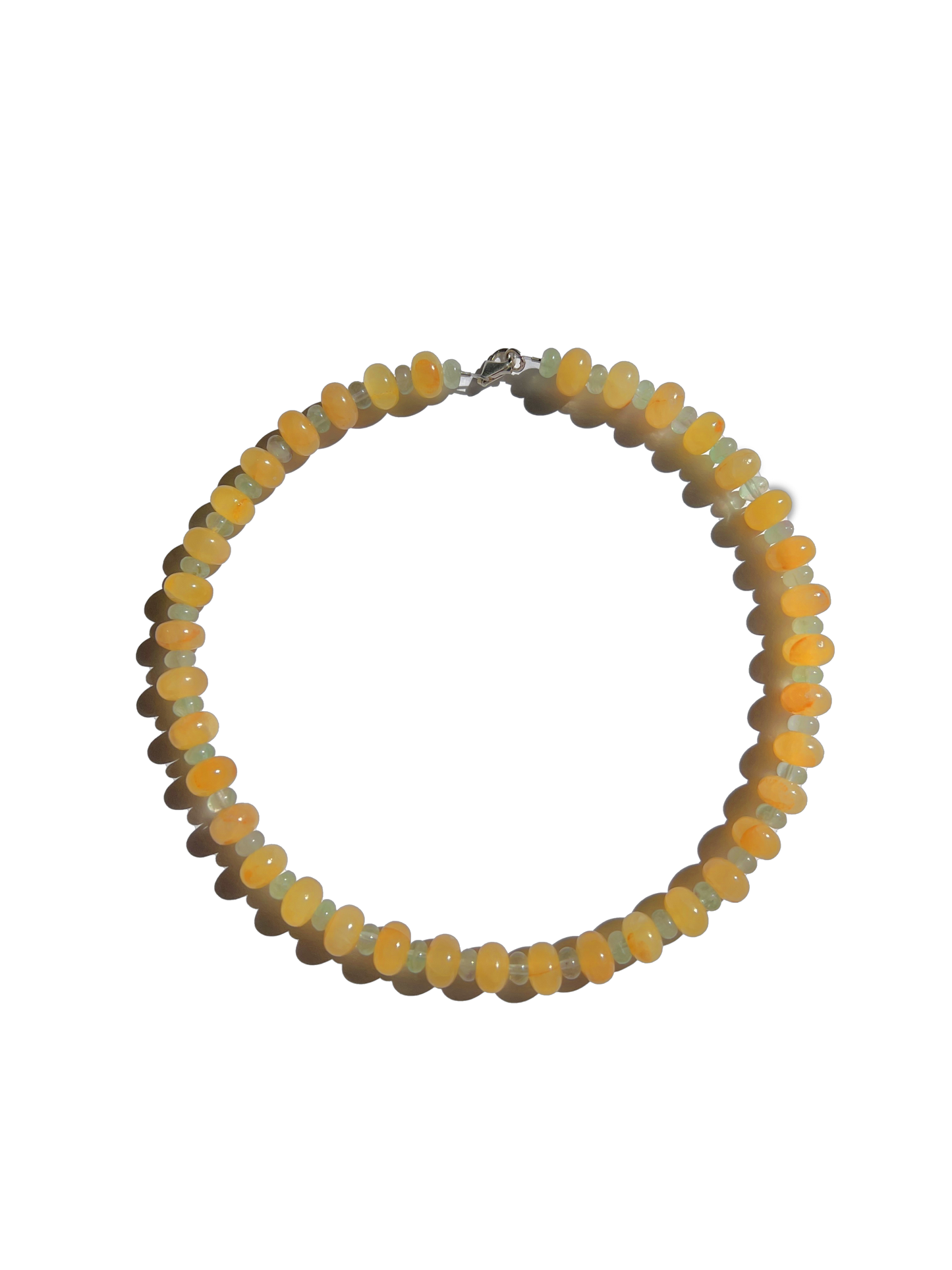 Citrine Skies Necklace A soft summer day, captured in stone.Inspired by the golden warmth of citrine sunsets and the tranquility of clear skies. Blends butter yellow and sky blue tones in a dreamy, refreshing palette. Handcrafted with natural jade gemstones and finished with 925 sterling silver clasp. Featuring: Material: Natural jade stones - Length: 42 cm - 925 sterling silver clasp