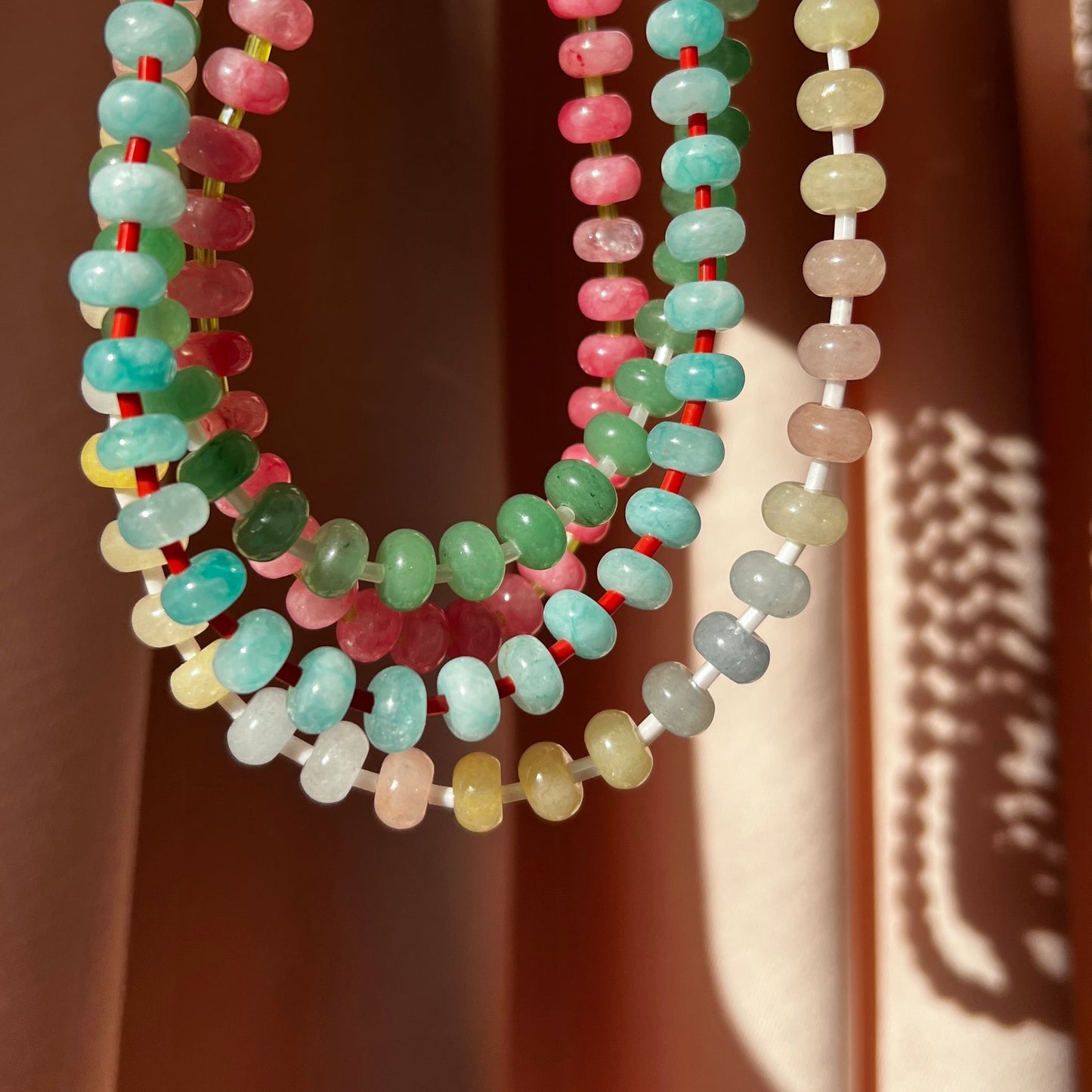 the whole collection of handbeaded necklace made using button shaped beads of  agate stones with tiny colorful glass beads. trending chunky beaded necklace for summer