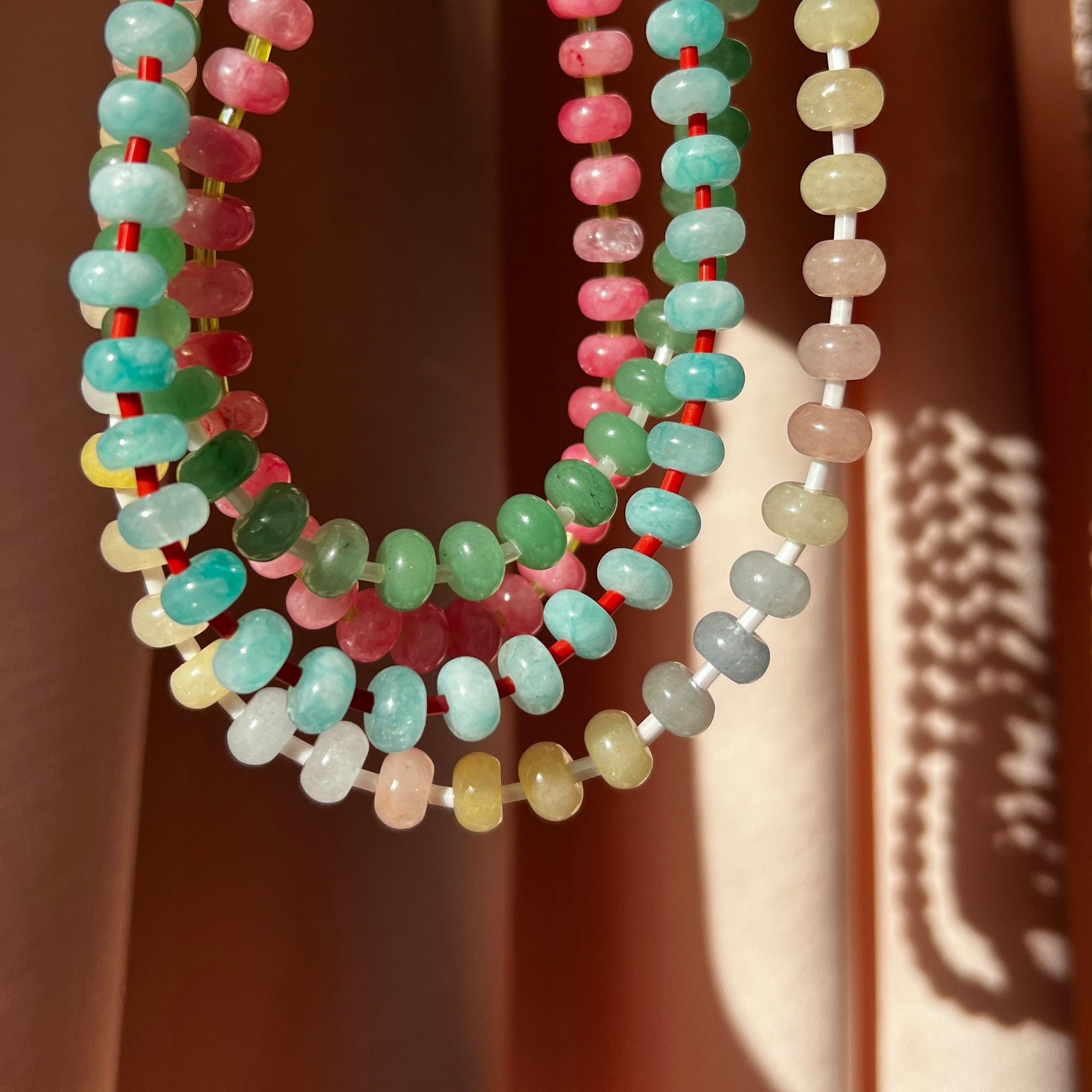 the whole collection of handbeaded necklace made using button shaped beads of  agate stones with tiny colorful glass beads. trending chunky beaded necklace for summer