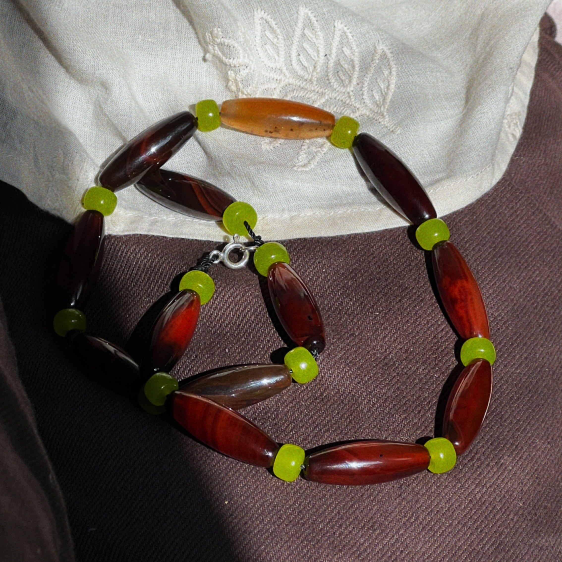 Necklace with brown agate and green jade stones
