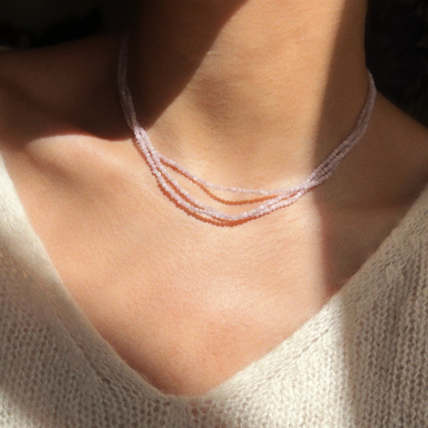 Close-up of shot for lilac three layered necklace 