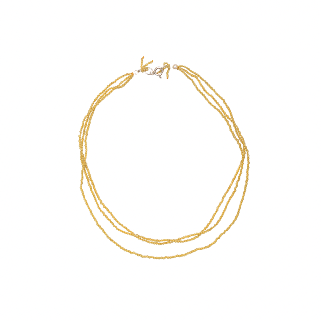 yellow necklace on a white background