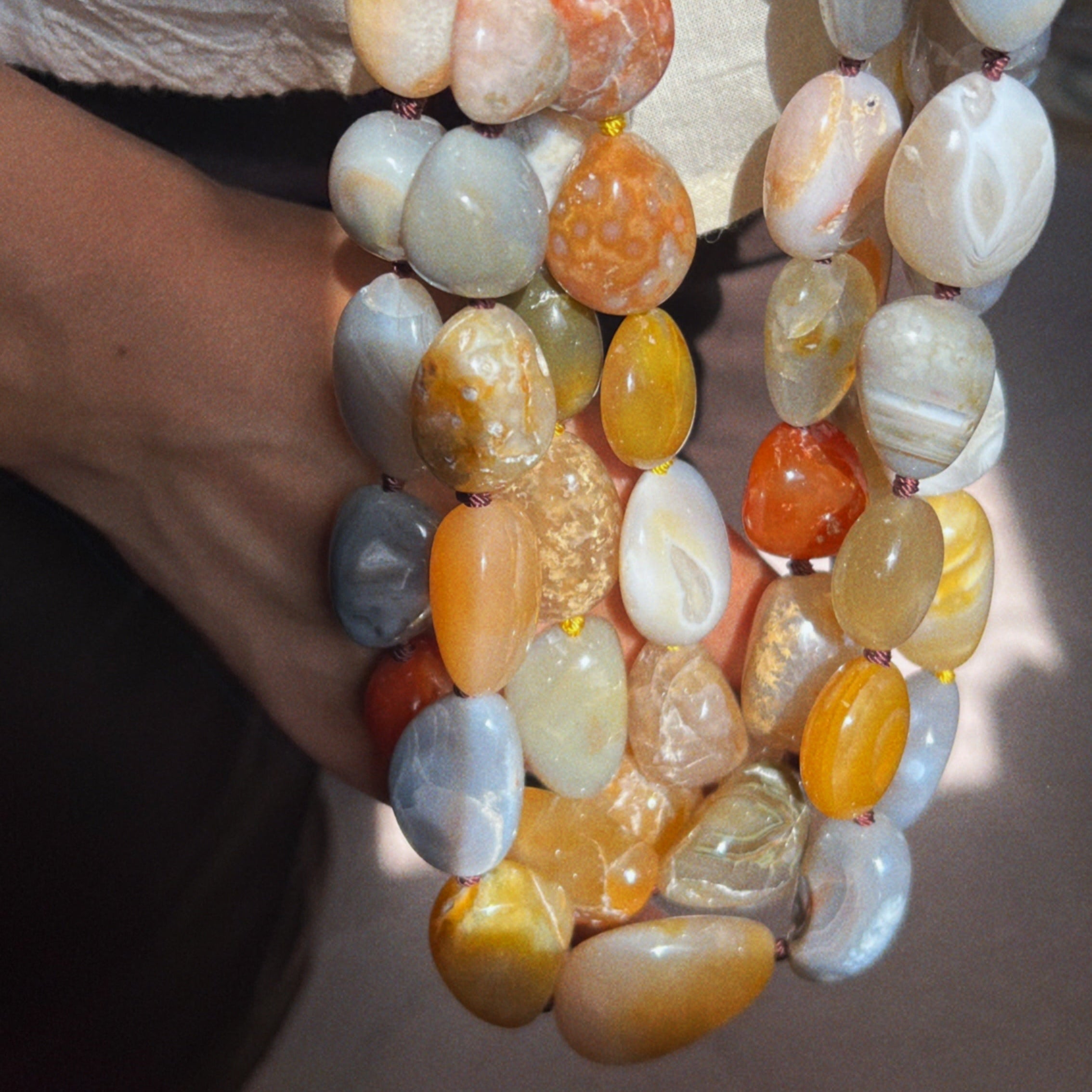 Necklace with multicolored chunky agate stones in oranges and yellow that looks like wearable mangoes