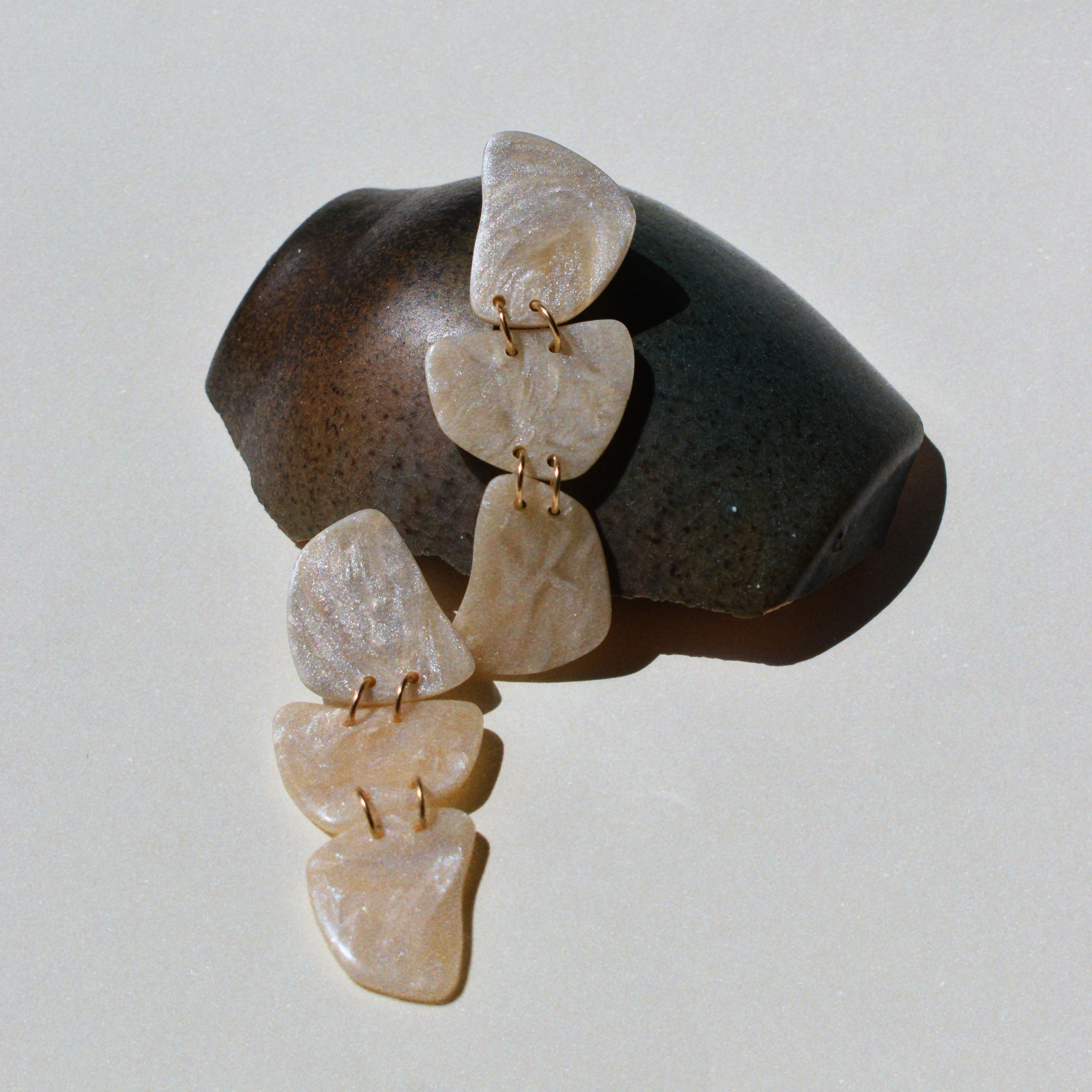 Handmade polymer clay earrings in pearly white, using 14k gold-filled jump rings and 925 sterling silver post