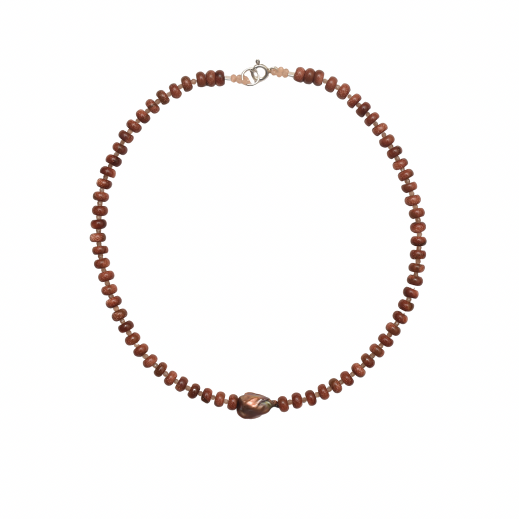 brown beaded necklace with a centered brown natural pearl on a white background