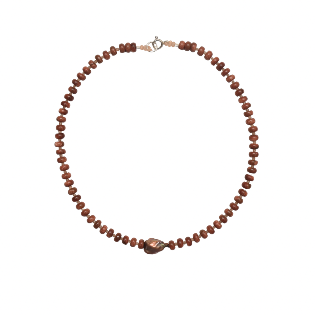 brown beaded necklace with a centered brown natural pearl on a white background